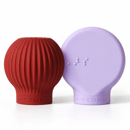 ByStorm Better Together Pack in maroon and lilac: the ribbed Betty ball grip in maroon beside the flat Margie paddle grip in lilac