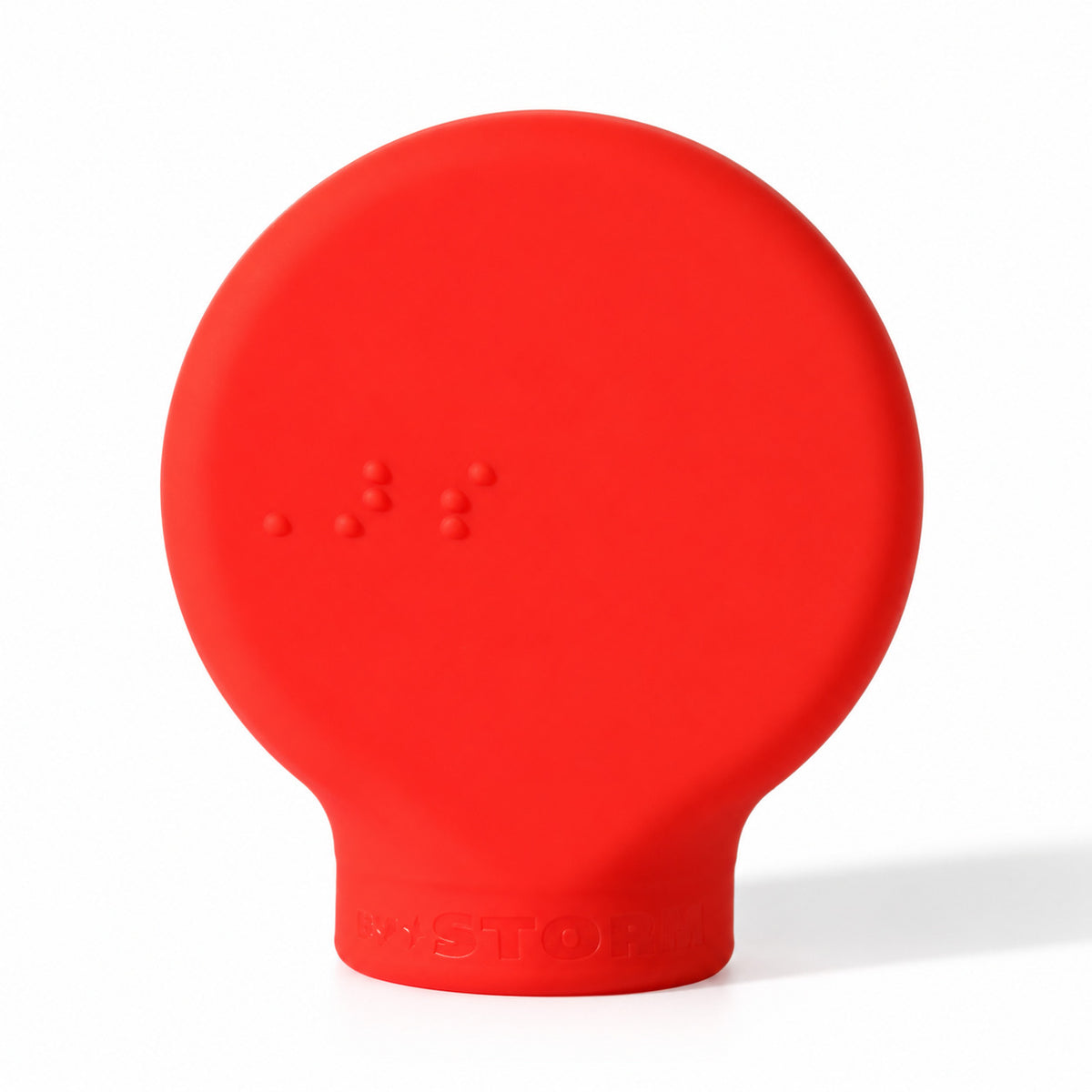ByStorm Margie makeup grip in red, a flat silicone paddle with Braille on the front, for people whose fingers do not curl easily
