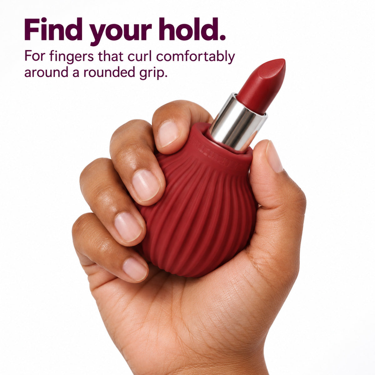 Hand curled around a maroon ByStorm Betty grip holding a lipstick. Text reads find your hold: for fingers that curl comfortably around a rounded grip