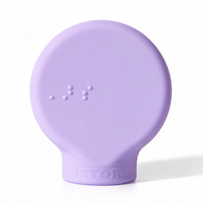 ByStorm Margie makeup grip in lilac, a flat silicone paddle with Braille on the front, for an open-hand hold