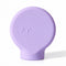 ByStorm Margie makeup grip in lilac, a flat silicone paddle with Braille on the front, for an open-hand hold