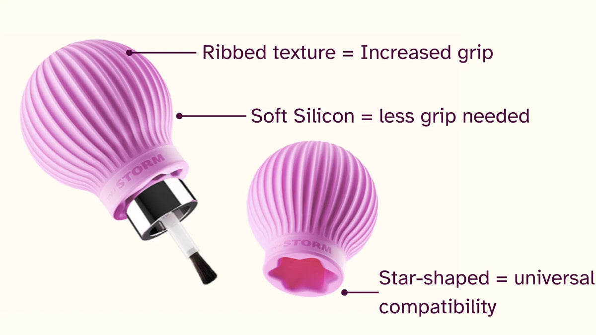 Pink ball shaped ergonomic grip aids attached to a nail polish