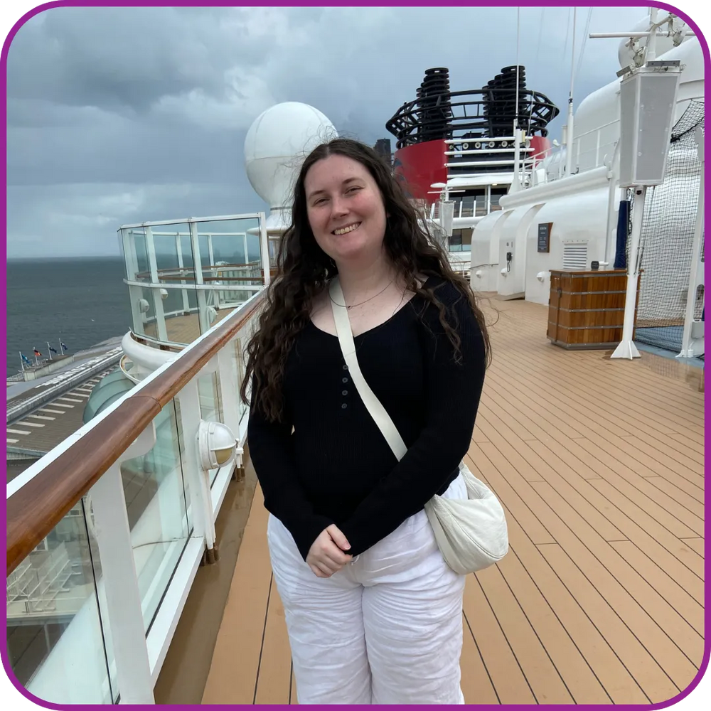Woman standing on a cruise ship deck with ocean view