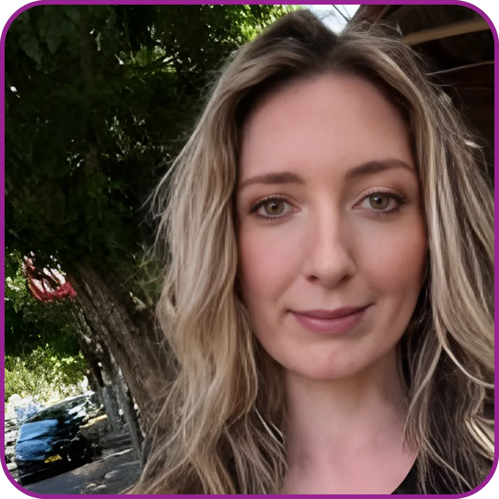 Woman with long blonde hair wearing a black top