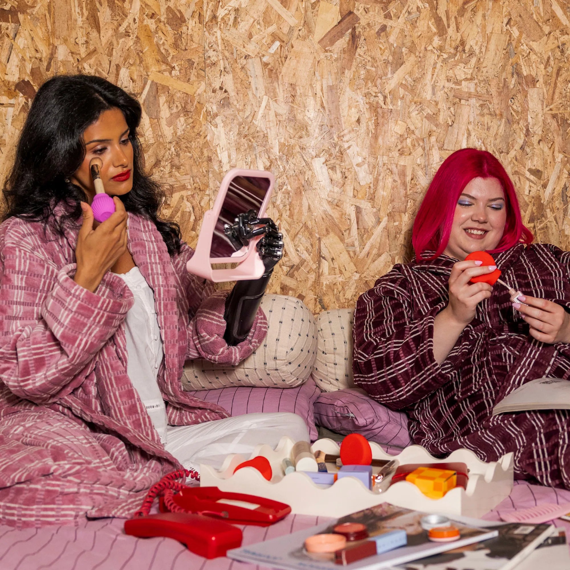 Two women using By Storm adaptive makeup grips, inclusive beauty tools designed in Australia