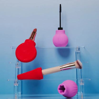 ByStorm adaptive makeup grip tools with lipsticks, brush and mascara on a stand