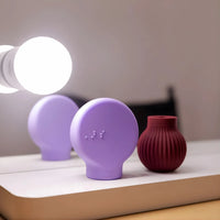 Betty in mauve and Margie in lilac adaptive makeup grip tools by ByStorm for accessible beauty