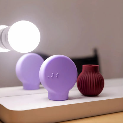 Betty in mauve and Margie in lilac adaptive makeup grip tools by ByStorm for accessible beauty