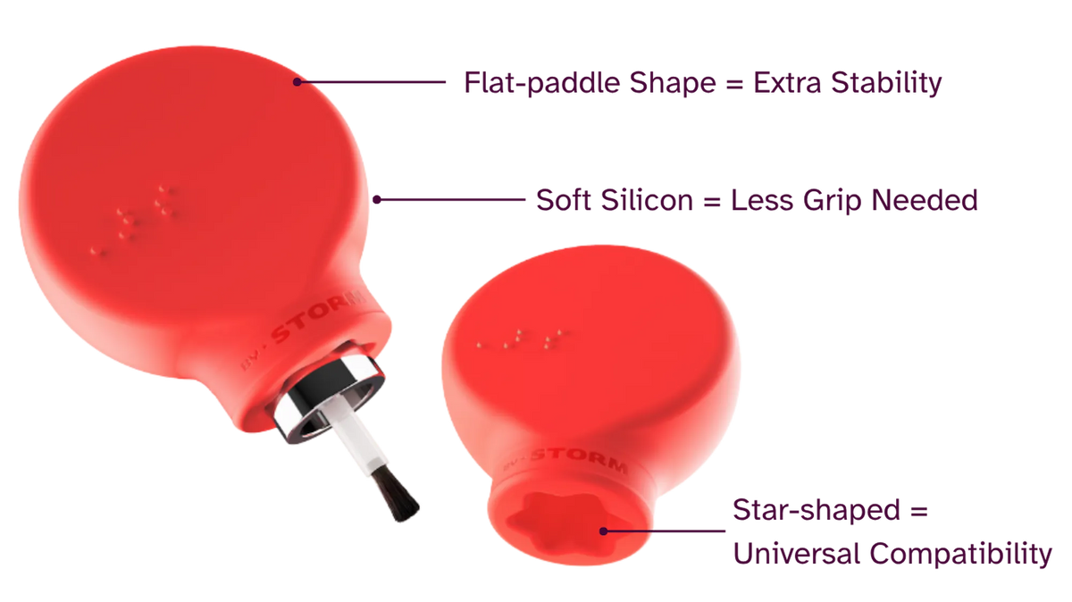 Margie, a red paddle-shaped accessible makeup tool by ByStorm designed for people with limited grip strength