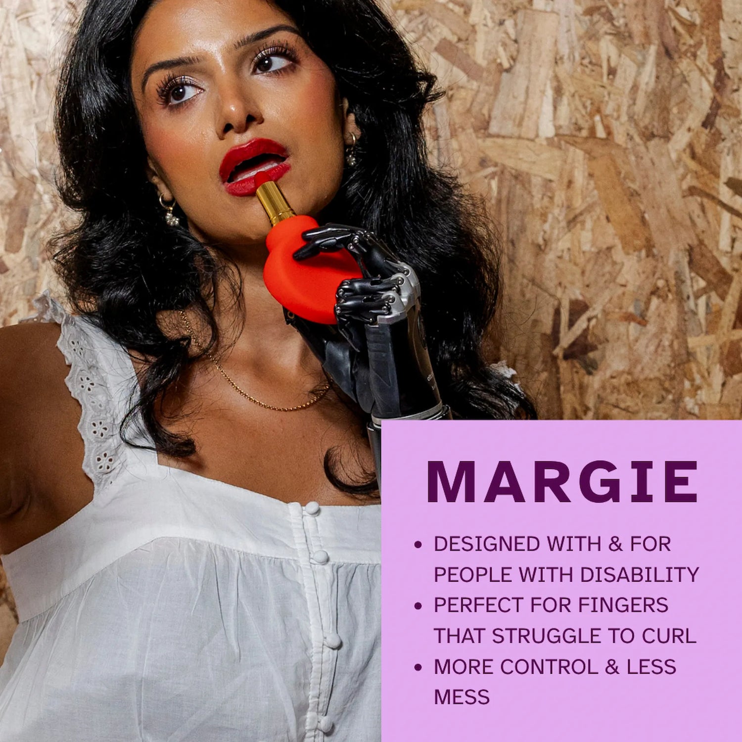 ByStorm Margie red adaptive makeup grip applying lipstick with prosthetic arm
